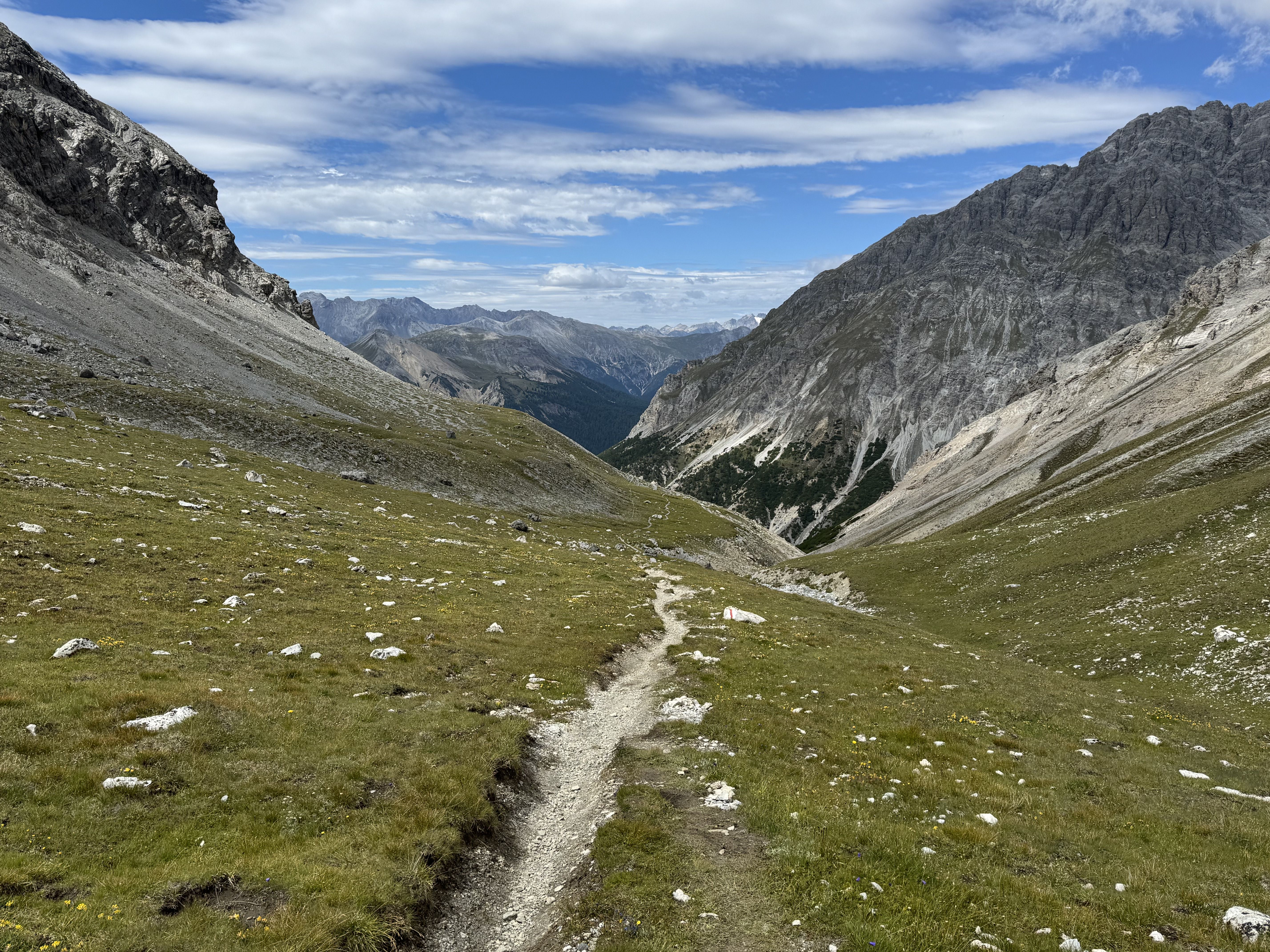 Trail running from the village of ***S-charl*** to the ***Ofenpass***